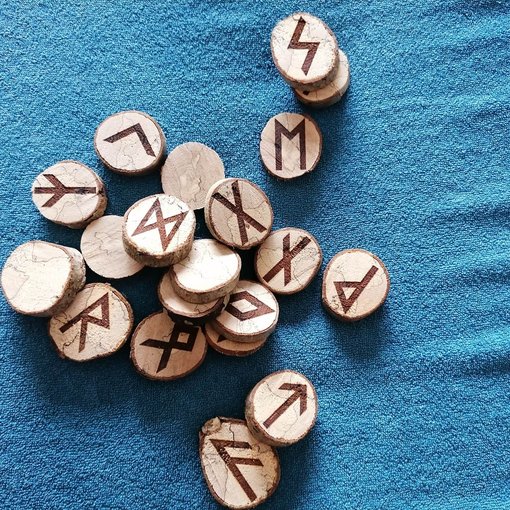 Nordic Runes Scattered on Surface