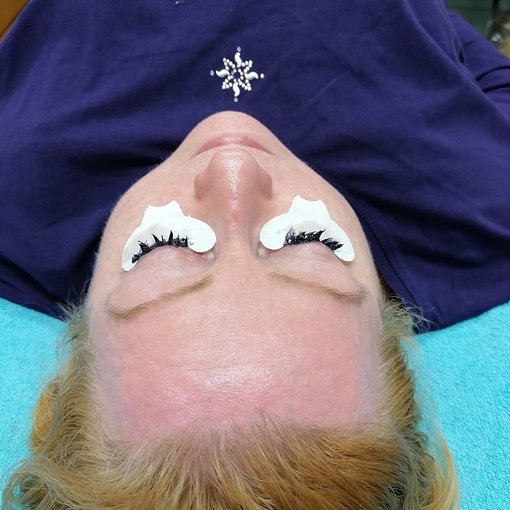 Woman having eye lashes tinted