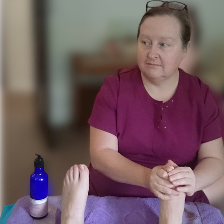 Therapist massaging feet